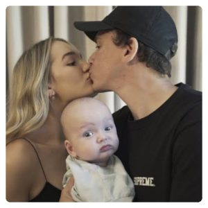 Logic Dadboy kissing his wife and the baby is jealous