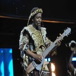 Ihashi Elimhlophe in traditional Zulu attire on stage